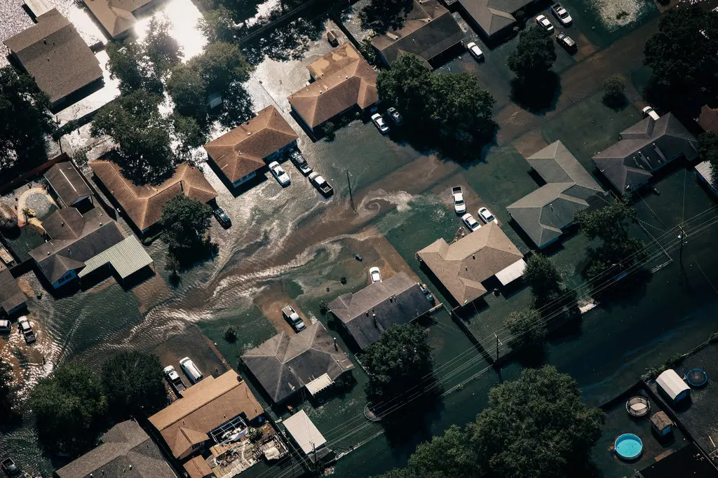 Floodwater surrounding homes in Beaumont, Texas (Source: Alyssa Schukar for The New York Times)