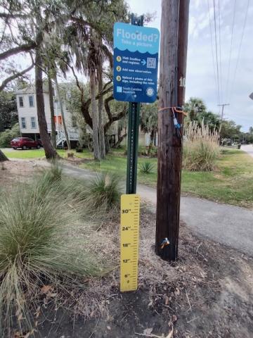 community flood watch program sign