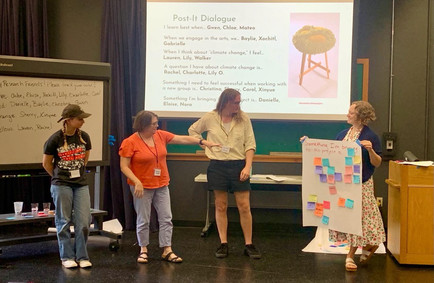 Assistant Professor Lara Dossett working with a fellow UT researcher, a middle school teacher and high school student from Ann Richards School in June 2024.