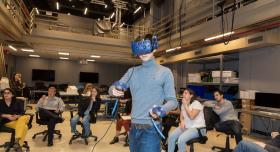 student demonstrates a VR game