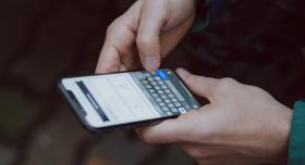 man holding cell phone