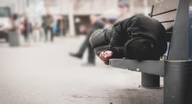 Homeless man on bench