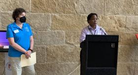 LaJuan Tucker (R) delivers opening remarks and introduces Mayor Pro-Tem Alison Alter (L). Photo Credit: Weston Rose.
