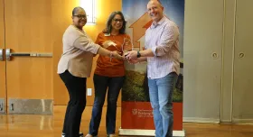 Araceli McBeth and Rebecca Gomez, parent community liaisons at Newton Collins Elementary School and Ojeda Middle School, respectively, accept the Cornerstone Award from WCWH chair Mike Mackert on behalf of DVISD. 