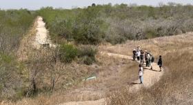 People walk along a path with restored thorn scrub in Estero Llano Grande State Park, near Pharr, Texas. Photo credit: Maggie Hansen