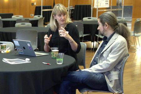 Two members of the winning team, Leah Whigham (College of Natural Sciences) and Pawel Misztal (Cockrell School of Engineering), discuss their proposal at this year’s flash funding competition on February 6, at UT Austin.